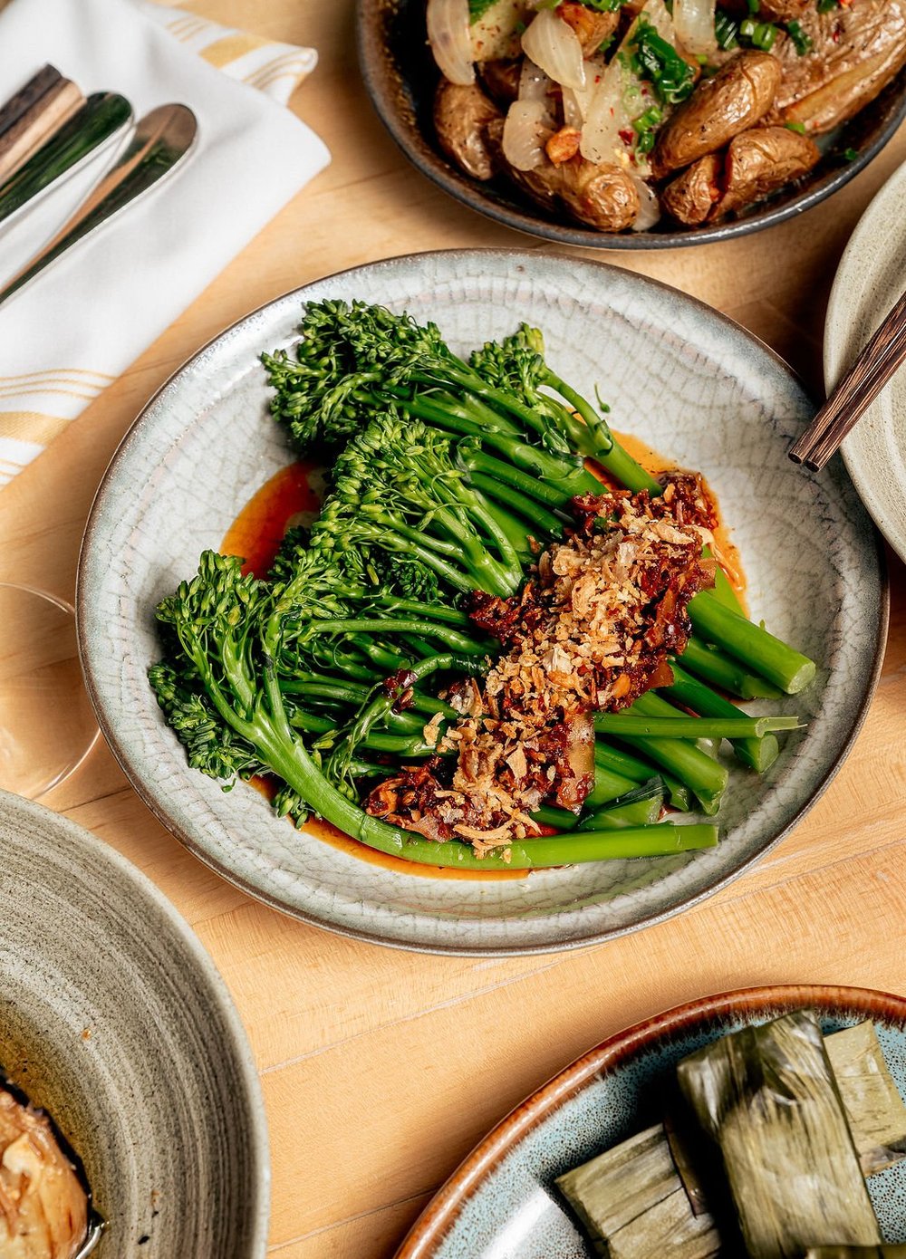 HaiSous baby broccoli with chili crisp and coconut