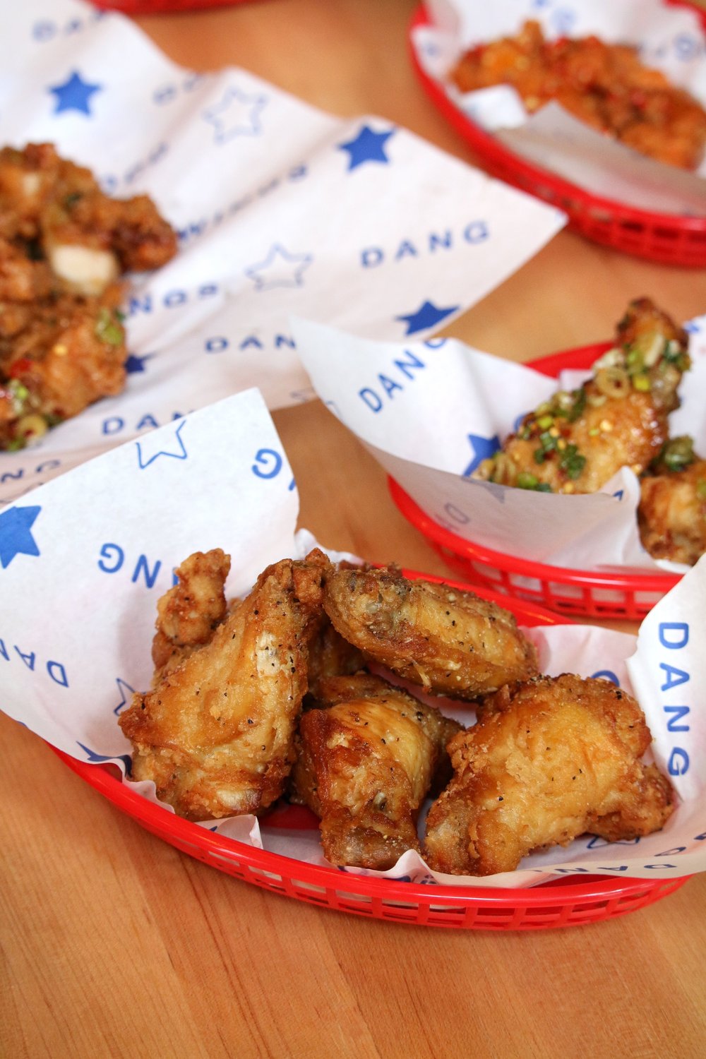 Dang Good Wings in red baskets with branded paper