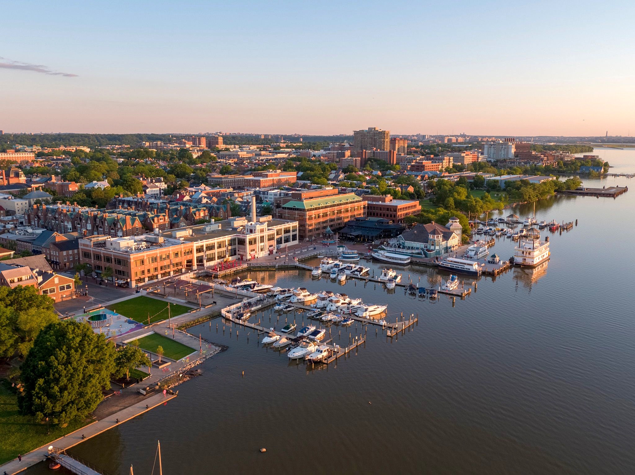 Aerial view of the waterfront and marina at sunset, supplied by the client