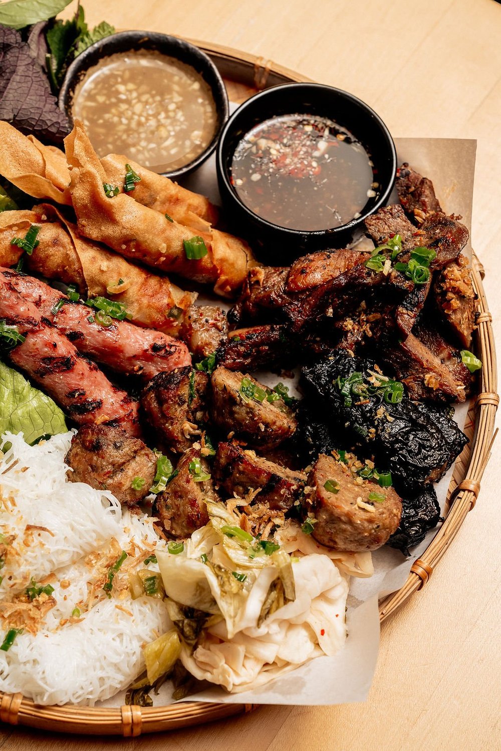 HaiSous grilled meat platter with herbs and noodles